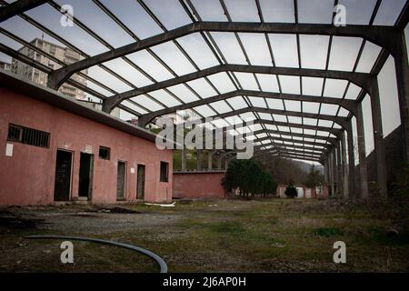 Old abandoned factory from below angle. Old warehouse. Run-down industrial building Stock Photo