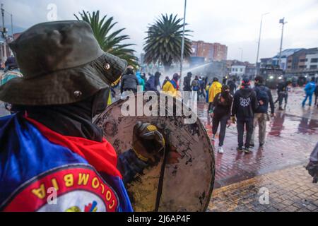 April 28, 2022, BogotÃ, Cundinamarca, Colombia: A protester holds a shield during the demonstration. Students clashed heavily with riot police at BogotÃ university as they marched to commemorate the day when the 2021 National Strike began in Colombia. (Credit Image: © Antonio Cascio/SOPA Images via ZUMA Press Wire) Stock Photo