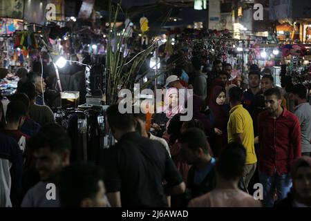 (220430) -- GAZA, April 30, 2022 (Xinhua) -- People shop at a market ahead of Eid al-Fitr in the southern Gaza Strip city of Rafah, April 29, 2022. (Photo by Yasser Qudih/Xinhua) Stock Photo