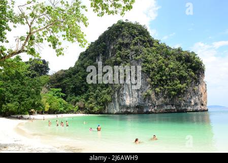 KRABI, THAILAND - March 25, 2022 : Tourists are playing in the water and relaxing with the beautiful nature at hong island, Than Bok Khorani National Stock Photo