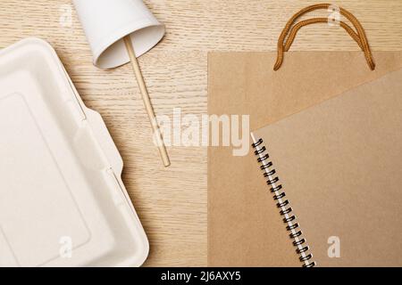 Eco friendly concept, Food box paper cup paper bag and notebook made from natural fiber. Stock Photo