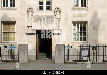 London, UK - March 21, 2022: Main entrance to the Royal Academy of Dramatic Art - RADA - on Gower Street, Camden, Central London.  A sculpture over th Stock Photo