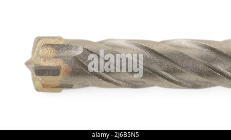 Extreme close up of the hard alloy drill head for concrete isolated on white with clipping path. Large drill bit macro with selective focus Stock Photo