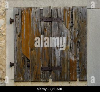 A shuttered window in an historic abandoned building in the medieval village of Buzet in Istria, western Croatia Stock Photo