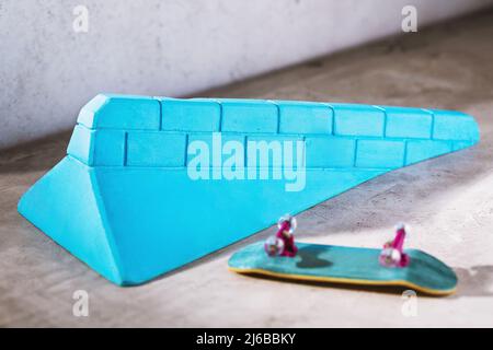 Gypsum ramp blue and fingerboard on the table, close-up Stock Photo