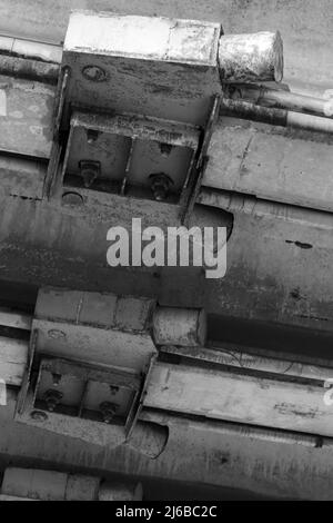 Steel bridge elements, bottom view, bolts connection. Black and white photo Stock Photo