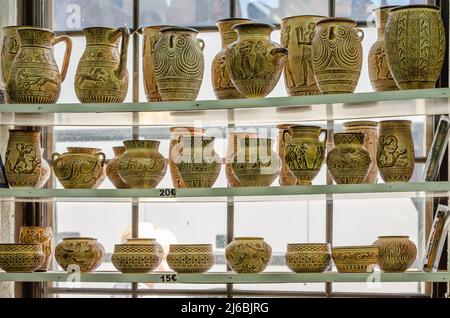 Kalambaka, Greece - June 10, 2018: A look at the exhibited items of a local shop in the city of Kalambaka in Greece. Stock Photo