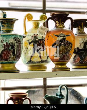 Kalambaka, Greece - June 10, 2018: A look at the exhibited items of a local shop in the city of Kalambaka in Greece. Stock Photo