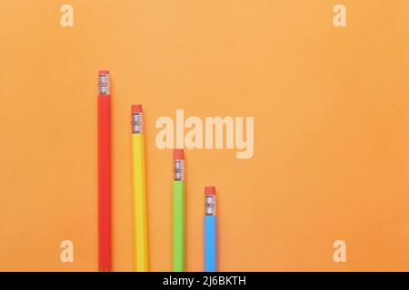 flat composition of colorful pencils on orange background  Stock Photo