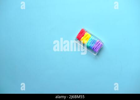 rainbow color Rubber bands on color background  Stock Photo