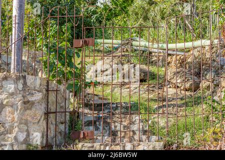 Old rusted gate and steps in St Maarten Stock Photo