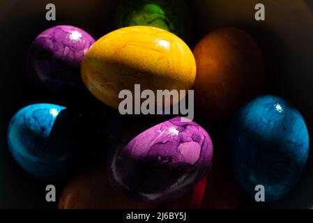 Brightly colored Easer eggs in a bowl Stock Photo