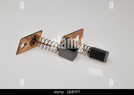 Carbon brush for electrical micromotor on white background. Macro image. Stock Photo