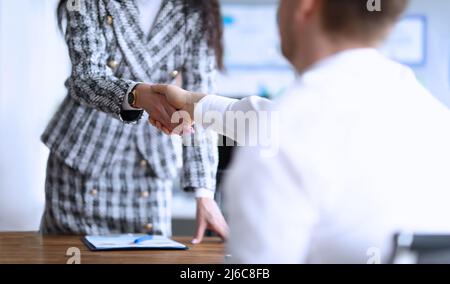 Business partners shaking hands after making good deal Stock Photo
