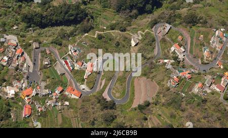 Aerial view of a road and houses in the mountainous village of Curral das Freiras, Madeira, Portugal.  As seen from the mountainside. Stock Photo