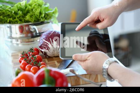 Vlogger chef showing ripe vegetables ingredients, video for culinary vlog Stock Photo