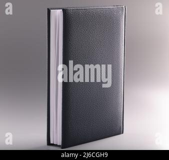 Black leather notebook or diary on grey background Stock Photo