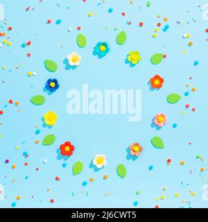 Multi colored multi shaped sprinkles on blue Stock Photo