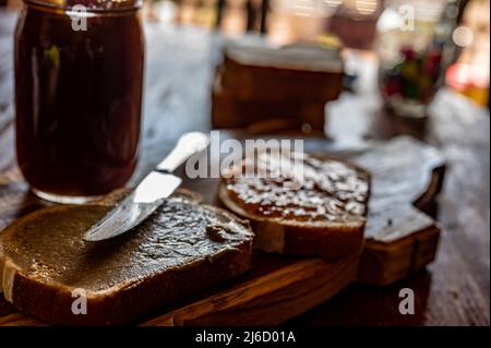 selective focus on butter knife edge used to spread a sunflower butter  Stock Photo