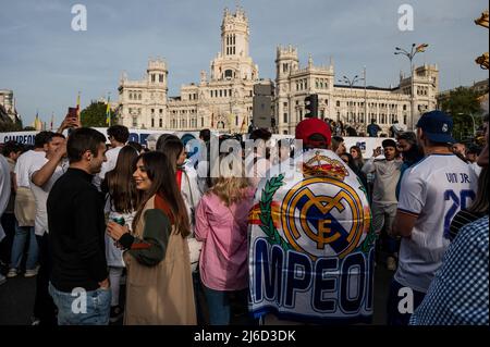 Real Madrid fans in Plaza de Cibeles celebrating the 35th La Liga national title that Real Madrid team won following their victory in a match against RCD Espanyol. Stock Photo