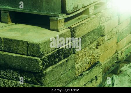 A stack of clay bricks.Material for construction. Stock Photo