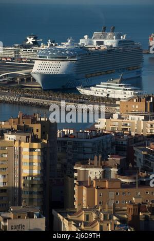A general view shows the cruise ship 'Wonder of the Seas' moored after arriving at Malaga Port. The new cruise ship of 'Royal Caribbean’s' is the world's largest cruise ship which can carry up to 6,988 passengers and 2,300 crew. The 'Wonder of the Seas', is 362 metres in length and 64 metres wide and has restaurants, swimming pools, a waterslide and a zipwire etc. Malaga port is the first European destination and berth of Royal Caribbean’s Wonder of the Seas. Stock Photo
