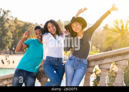 Group of multiracial young friends on vacation visiting a landmark. Stock Photo