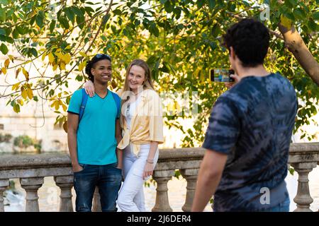 Group of teenage friends taking a photo on an outing in the park Stock Photo