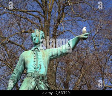 Historic statue of King Charles XII from 1868 in Stockholm, with a herring gull. Stock Photo