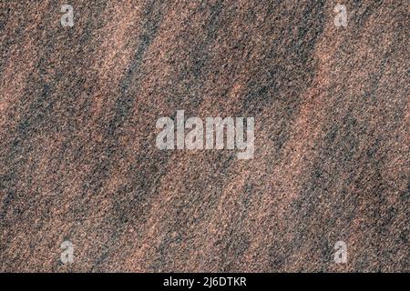 Seamlessly tileable synthetic texture resembling a red and black rock surface. Stock Photo