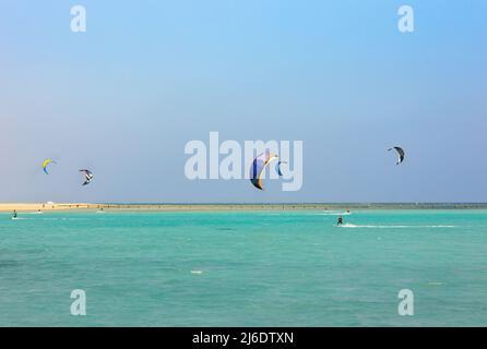 colorful kites for kiteboarding is flying in the blue sky Stock Photo