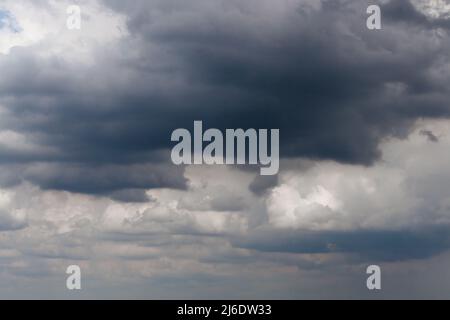 Dark sky full of clouds before the rain. Dark storm clouds on sky background Stock Photo