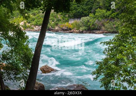 Rapids in the Niagara River near the so called whirlpool at the nagar falls. The river winds through the high gorges with immense speed. Niagara Falls Stock Photo