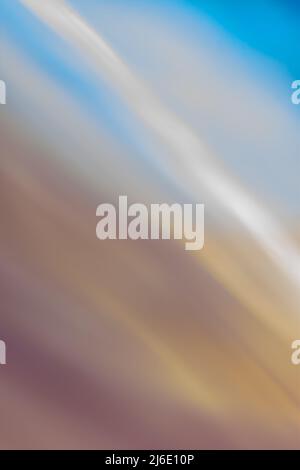 Abstract vertical brown beige blue background banner, slanting wave lines with soft blur. Multicolored back. Stock Photo