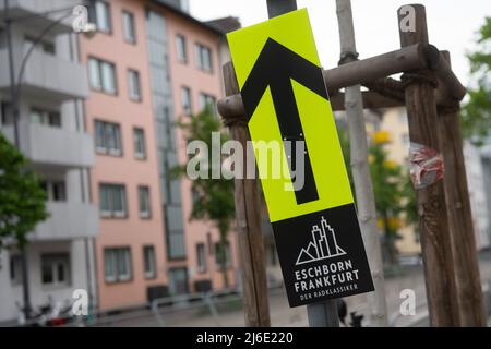 01 May 2022, Hessen, Frankfurt/Main: Cycling: UCI WorldTour - Eschborn - Frankfurt (185 km). A sign points out the route. Photo: Sebastian Gollnow/dpa Stock Photo