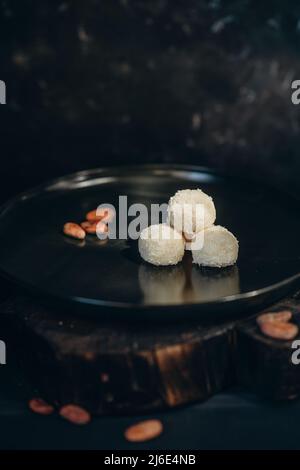 handmade chocolate truffle candies on black background Stock Photo