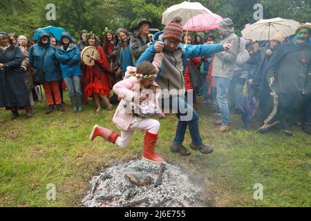 Chalice Well, Glastonbury, Somerset, UK, 1st May, 2022: Hundreds of people gather at the Chalice Well garden, after a two year hiatus due to the pandemic, to celebrate Beltane on the 1sst May: Credit Natasha Quarmby-A LAMY LIVE NEWS Stock Photo