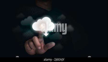 Cloud storage concept. Cloud computing technology, virtual icons touched by a businessman with binary code on dark background with copy space. Busines Stock Photo