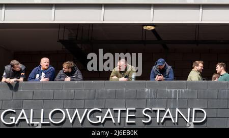 Football fans wait looking out from the back of the Gallowgate Stand of St James' Park stadium, home of Newcastle United, in Newcastle upon Tyne, UK. Stock Photo