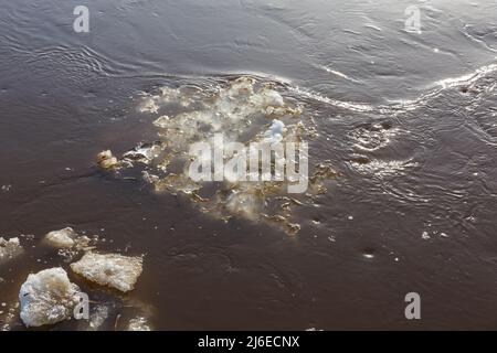 ice floe drifts downstream in springtime. spring flood. Stock Photo