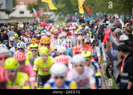 01 May 2022, Hessen, Eschborn: Cycling: UCI WorldTour - Eschborn - Frankfurt (185 km). Riders start between spectators. Photo: Sebastian Gollnow/dpa Stock Photo