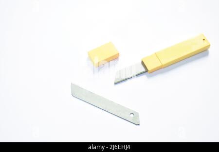 cutter blade in yellow box package on white background Stock Photo