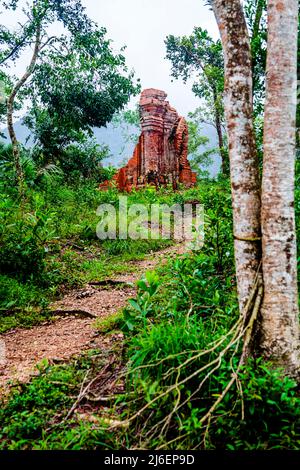A small dirt path leading up to one of the buildings at the ruins of My Son Sanctuary. Stock Photo