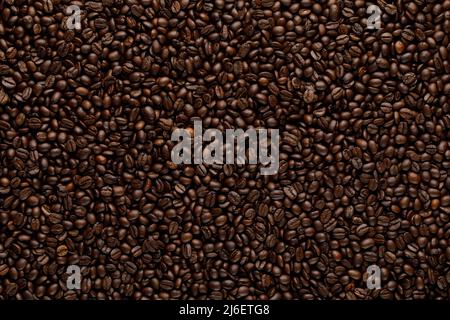 Fresh roasted coffee beans texture. Mocha grains abstract background Stock Photo