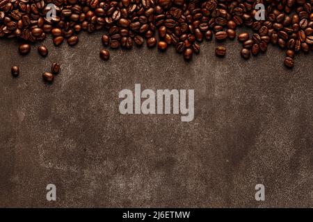 Coffee frame made of roasted beans with empty space for inscriptions or logo. Abstract background Stock Photo