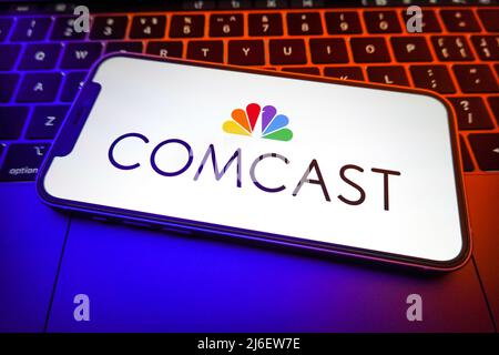 In this photo illustration, a Comcast logo is displayed on the screen of a smartphone. (Photo by Sheldon Cooper / SOPA Images/Sipa USA) Stock Photo