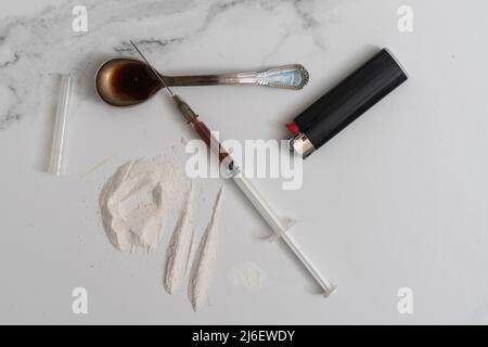 Drugs of various kinds and human skulls on the floor, Collection of different hard drugs Heroin Stock Photo