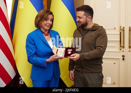 Kyiv, Ukraine. 01st May, 2022. Ukrainian President Volodymyr Zelenskyy, right, presents Speaker of the U.S. House of Representatives Nancy Pelosi with the Order of Princess Olga, at the Mariyinsky palace, May 1, 2022 in Kyiv, Ukraine. Pelosi is the highest ranking elected U.S. official to visit Kyiv since the Russian invasion. Credit: Ukraine Presidency/Ukraine Presidency/Alamy Live News Stock Photo
