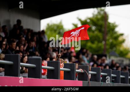 London, UK. 01st May, 2022. A young boy waves an Arsenal flag during the Barclays FA Womens Super League game between Arsenal and Aston Villa at Meadow Park in London, England.  Liam Asman/SPP Credit: SPP Sport Press Photo. /Alamy Live News Stock Photo