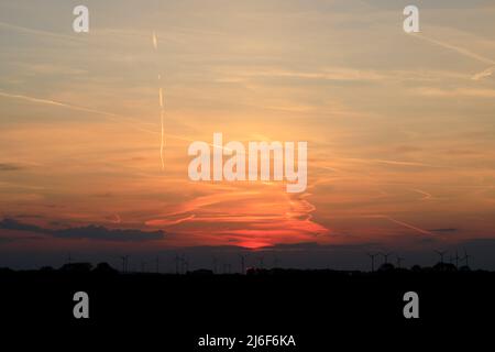 Sunset With Colorful Sky With Wind Mill Silhouette Stock Photo